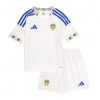 Camisa de Futebol Leeds United Equipamento Principal Infantil 2025-26 Manga Curta (+ Calças curtas)